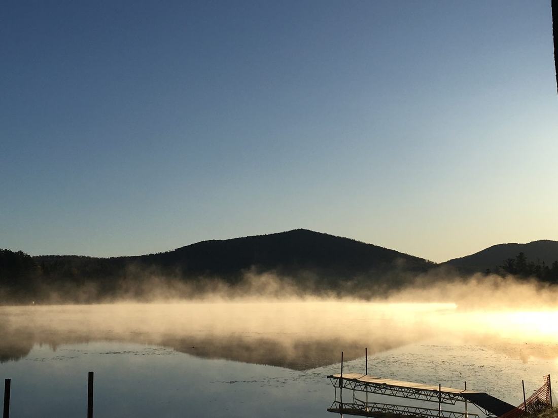 Mist rising off the lake at dawn